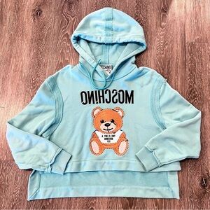 Moschino Embroidered Teddy Bear Cropped Hoodie. Light blue. Size 6. Fits a S & M